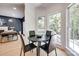 Bright breakfast nook features a round table, modern chairs, and large windows providing natural light at 1134 Blueberry Ln, Charlotte, NC 28226