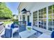 Relaxing deck features comfortable seating, overlooks the backyard, and large windows at 1134 Blueberry Ln, Charlotte, NC 28226