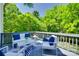Outdoor deck offers plenty of seating and a view of lush landscaping at 1134 Blueberry Ln, Charlotte, NC 28226
