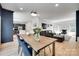 Open concept dining and living areas, showcasing modern décor and hardwood floors at 1134 Blueberry Ln, Charlotte, NC 28226