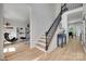 Bright foyer with hardwood floors, staircase, and access to a living area at 1134 Blueberry Ln, Charlotte, NC 28226