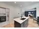 Open concept kitchen with a modern island, stainless steel appliances, and views of the dining area at 1134 Blueberry Ln, Charlotte, NC 28226