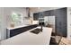 Sleek kitchen boasts stainless steel appliances, custom cabinets, and a spacious white countertop island at 1134 Blueberry Ln, Charlotte, NC 28226