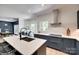 Open concept kitchen features island with seating and view to breakfast nook at 1134 Blueberry Ln, Charlotte, NC 28226