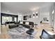 Open-concept living room with modern furnishings, neutral tones, and plenty of natural light at 1134 Blueberry Ln, Charlotte, NC 28226
