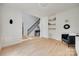 Open living area with hardwood floors, staircase, and stylish accents at 1134 Blueberry Ln, Charlotte, NC 28226