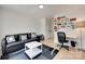 Relaxing living room featuring a black leather couch and hardwood floors at 1134 Blueberry Ln, Charlotte, NC 28226