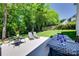 Expansive backyard patio is perfect for dining and relaxation with lush landscaping at 1134 Blueberry Ln, Charlotte, NC 28226