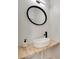 Modern powder room with vessel sink, black faucet, and round mirror creating a sleek design at 1134 Blueberry Ln, Charlotte, NC 28226