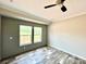 Bedroom with wood-look floors, two windows, and a ceiling fan at 118 Brett Will Ct, Taylorsville, NC 28681