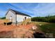 Rear view of the white home with access to the back yard at 118 Brett Will Ct, Taylorsville, NC 28681