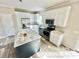 Bright kitchen with stainless steel appliances, white cabinetry, and an island at 118 Brett Will Ct, Taylorsville, NC 28681