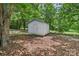 Backyard with a white shed, mature trees, and a peaceful, secluded atmosphere at 1192 Carolyn Dr # 9, Albemarle, NC 28001
