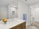 Elegant bathroom with a wooden vanity, marble countertop, modern fixtures, and white walls at 1192 Carolyn Dr # 9, Albemarle, NC 28001