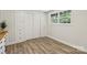 This bedroom is equipped with a window, a closet, built-in drawers, and hardwood flooring at 1192 Carolyn Dr # 9, Albemarle, NC 28001