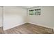 Bright bedroom featuring hardwood flooring and a large window at 1192 Carolyn Dr # 9, Albemarle, NC 28001
