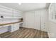 A spacious bedroom featuring built-in shelving, hardwood flooring, and a large closet at 1192 Carolyn Dr # 9, Albemarle, NC 28001