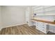 This room has built-in shelves and desk, hardwood flooring, and white walls at 1192 Carolyn Dr # 9, Albemarle, NC 28001
