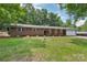 Charming single-story brick home with manicured lawn, mature trees, and attached two-car garage at 1192 Carolyn Dr # 9, Albemarle, NC 28001