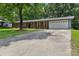 Spacious ranch-style home featuring a long driveway, two-car garage, and well-maintained front lawn at 1192 Carolyn Dr # 9, Albemarle, NC 28001