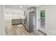 A modern kitchen featuring gray cabinetry, stainless steel appliances, and backyard access at 1192 Carolyn Dr # 9, Albemarle, NC 28001