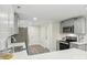 A well-lit kitchen with gray cabinets, white subway tile backsplash, and stainless steel appliances at 1192 Carolyn Dr # 9, Albemarle, NC 28001