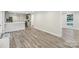 Spacious open living area with hardwood floors, a kitchen bar, and ample natural light at 1192 Carolyn Dr # 9, Albemarle, NC 28001
