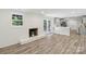 Inviting living area boasts a white brick fireplace and French doors to the backyard at 1192 Carolyn Dr # 9, Albemarle, NC 28001