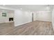 Bright living room boasts modern wood flooring, fresh paint, and a fireplace at 1192 Carolyn Dr # 9, Albemarle, NC 28001