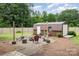 The cozy backyard features a fire pit area surrounded by comfortable seating, perfect for entertaining guests at 127 Leonidas St, Fort Mill, SC 29715