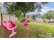 Spacious backyard includes a swing set, mature trees, and a screened porch attached to the home at 127 Leonidas St, Fort Mill, SC 29715