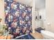 Well-lit bathroom with a floral shower curtain, single vanity, and modern fixtures at 127 Leonidas St, Fort Mill, SC 29715
