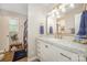 Bright bathroom featuring marble counters, brass fixtures, and an updated vanity at 127 Leonidas St, Fort Mill, SC 29715