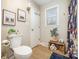 Bright bathroom featuring a toilet, vanity, and stylish decorative elements that create a welcoming space at 127 Leonidas St, Fort Mill, SC 29715