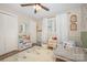 Inviting bedroom with decorative wallpaper, natural light, and a comfortable bed at 127 Leonidas St, Fort Mill, SC 29715