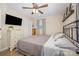 Comfortable bedroom with hardwood floors, a ceiling fan, closet, and updated colors at 127 Leonidas St, Fort Mill, SC 29715