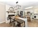Inviting dining room with fireplace, open to kitchen and breakfast bar at 127 Leonidas St, Fort Mill, SC 29715