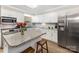Bright kitchen features white cabinets, stainless steel appliances, and a breakfast bar at 127 Leonidas St, Fort Mill, SC 29715