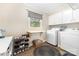 Functional laundry room with washer, dryer, folding table, and ample storage for organization at 127 Leonidas St, Fort Mill, SC 29715