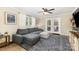 Cozy living room with a comfortable sectional sofa, wood-look floors and stylish decor at 127 Leonidas St, Fort Mill, SC 29715