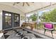 Covered porch area offers outdoor dining and relaxation opportunities, enhanced by views of the surrounding greenery at 127 Leonidas St, Fort Mill, SC 29715