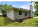 The home features a backyard with a well-maintained lawn and AC unit at 1321 Land Grant Rd, Charlotte, NC 28217