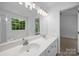 Spacious bathroom featuring a double vanity and large mirror at 1321 Land Grant Rd, Charlotte, NC 28217