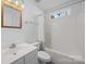 Standard bathroom featuring a tub/shower combination, vanity, and ample lighting at 1321 Land Grant Rd, Charlotte, NC 28217