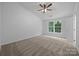 Bedroom with large windows, carpet, and ceiling fan at 1321 Land Grant Rd, Charlotte, NC 28217