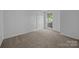 Bright bedroom with a neutral color scheme, and natural light at 1321 Land Grant Rd, Charlotte, NC 28217