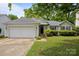 Inviting single-story home with a well-maintained lawn and attached garage at 1321 Land Grant Rd, Charlotte, NC 28217