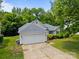 Charming home featuring a well-manicured lawn and a two-car garage at 1321 Land Grant Rd, Charlotte, NC 28217