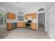 Well-lit kitchen with stainless steel appliances and updated tile floors at 1321 Land Grant Rd, Charlotte, NC 28217
