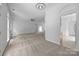 Open-concept living space with views into other rooms and natural light at 1321 Land Grant Rd, Charlotte, NC 28217